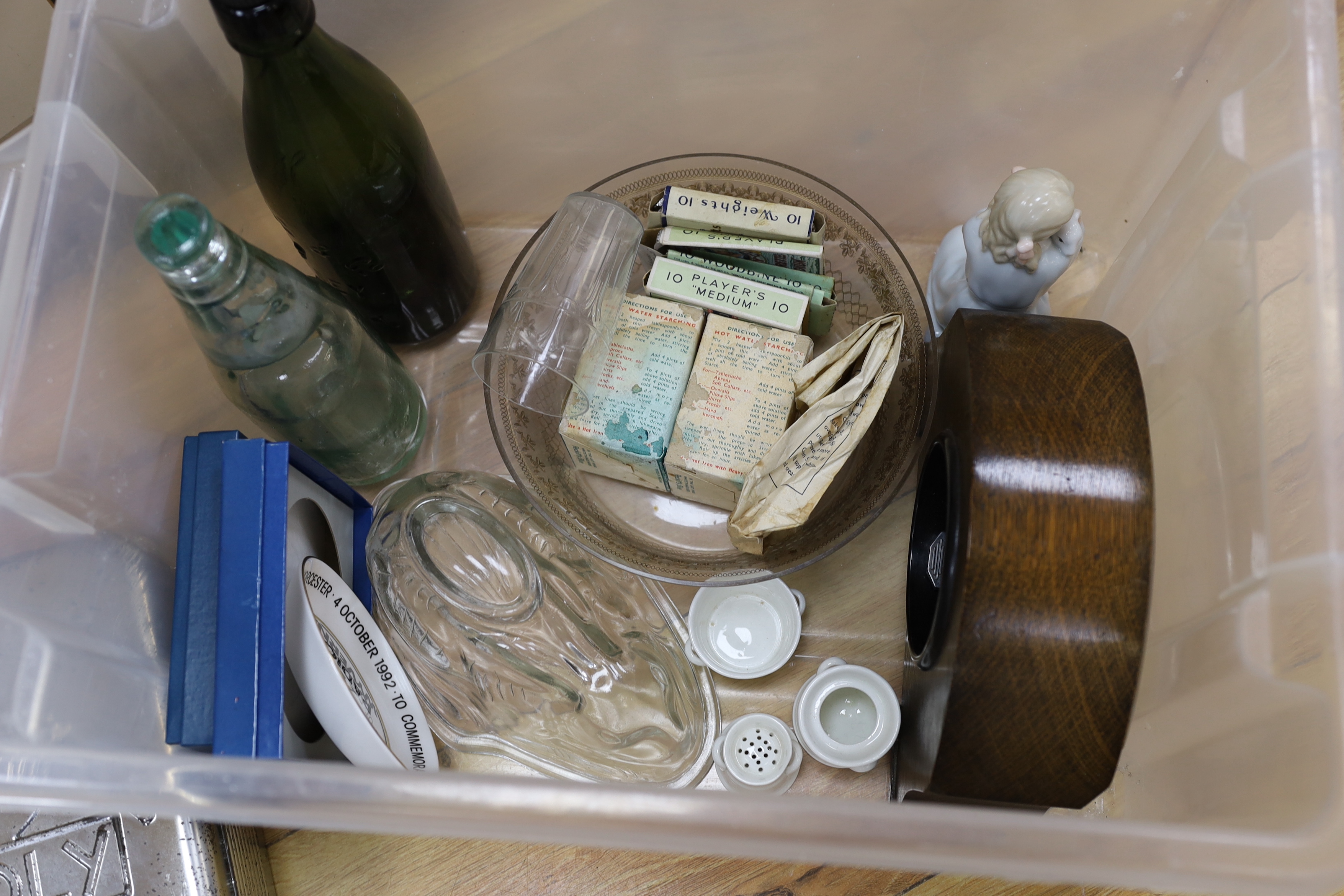 A black slate clock, tinned Monopoly game, old bottles, cigarette boxes and mixed collectables